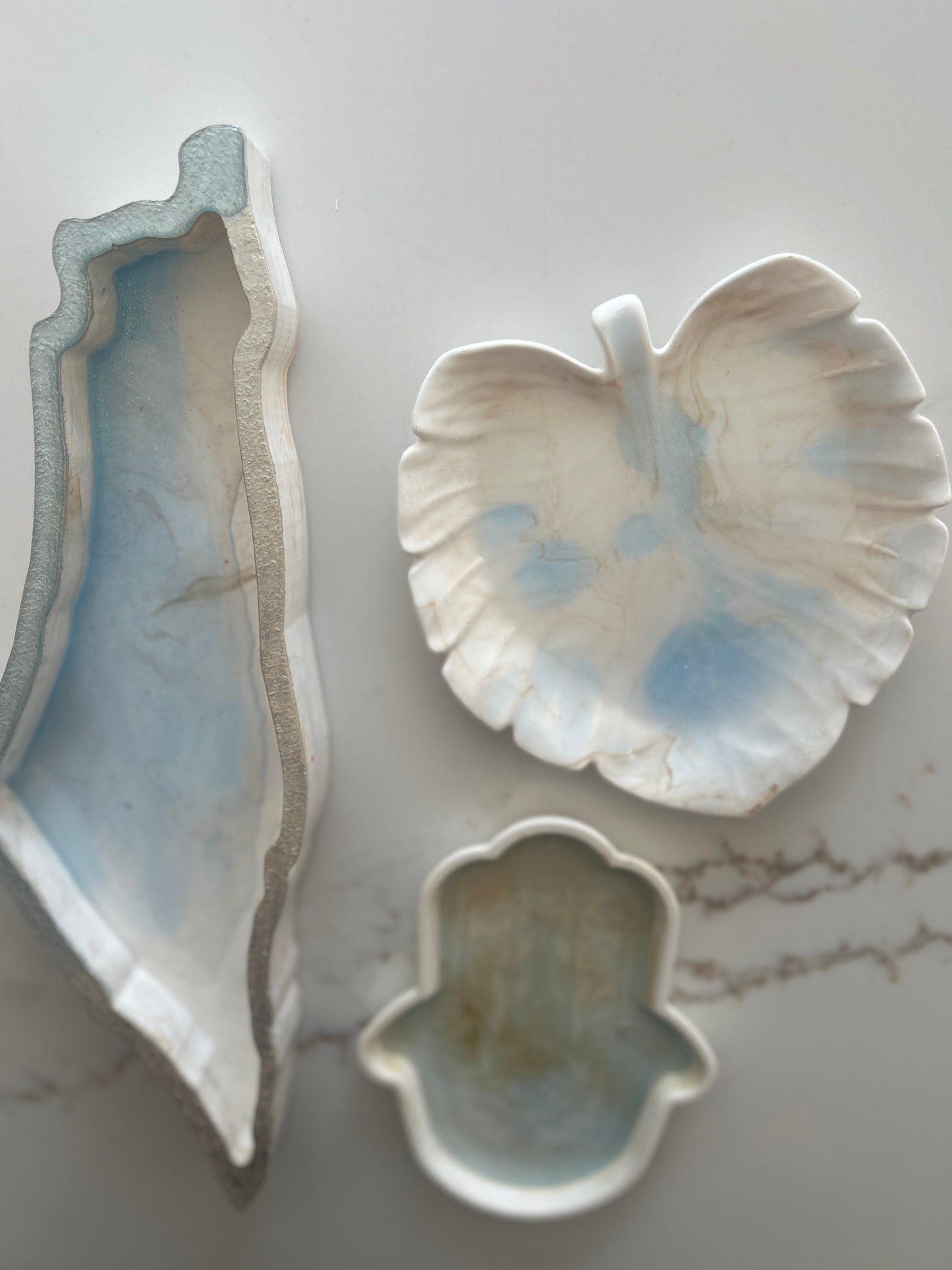Tray designs inspired by the Map of Israel, Hamsa & Leaf