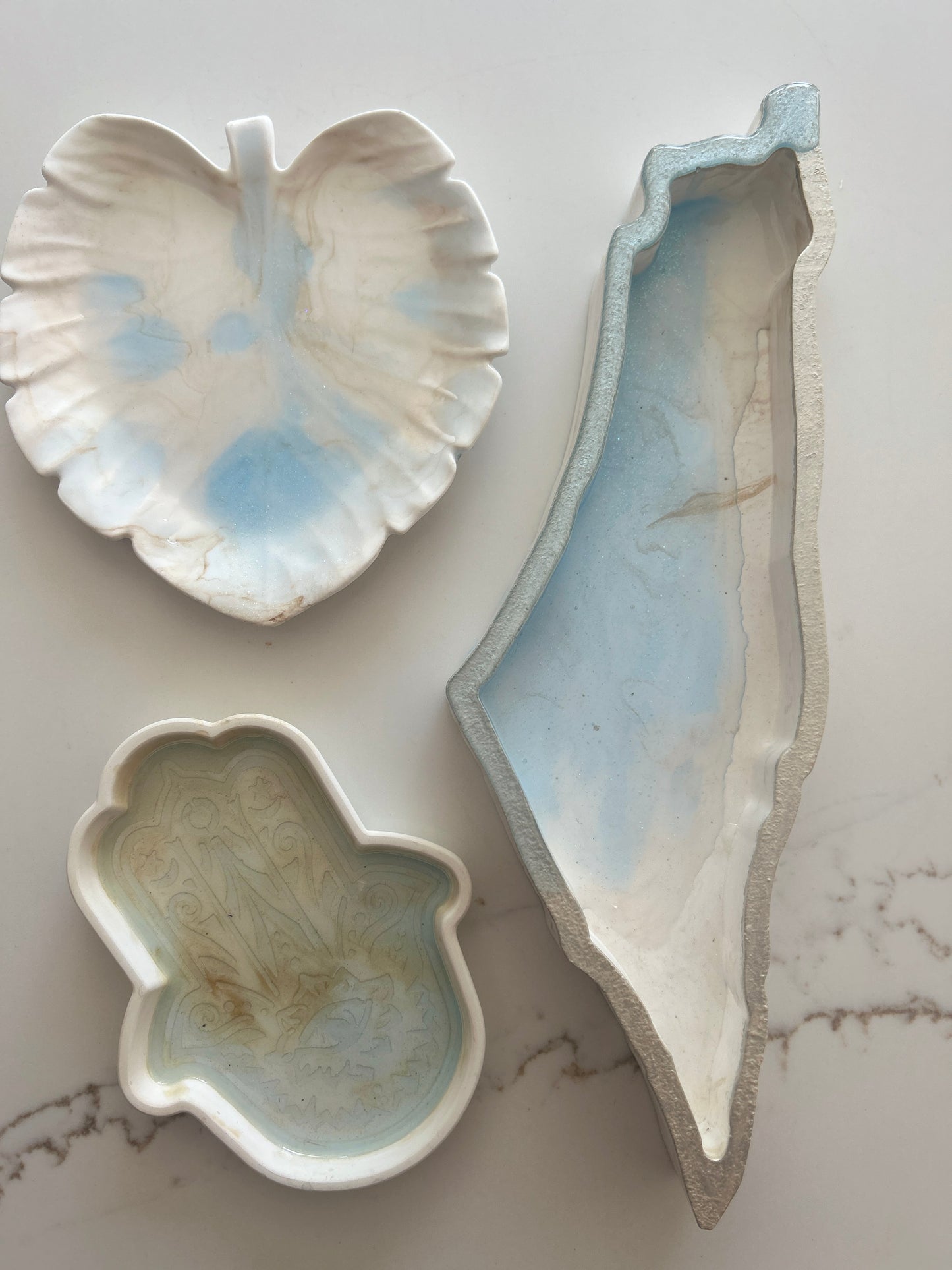 Tray designs inspired by the Map of Israel, Hamsa & Leaf