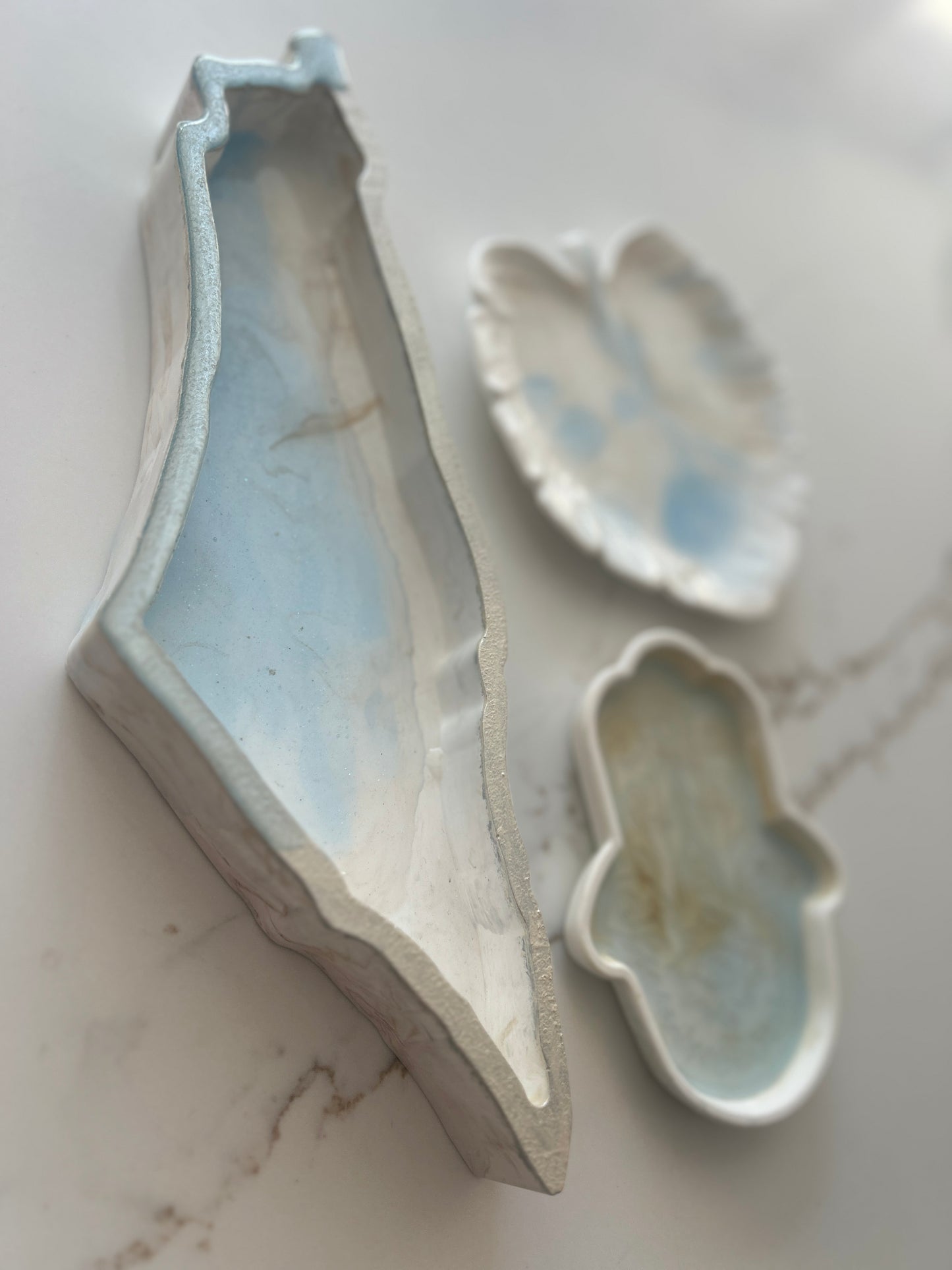 Tray designs inspired by the Map of Israel, Hamsa & Leaf