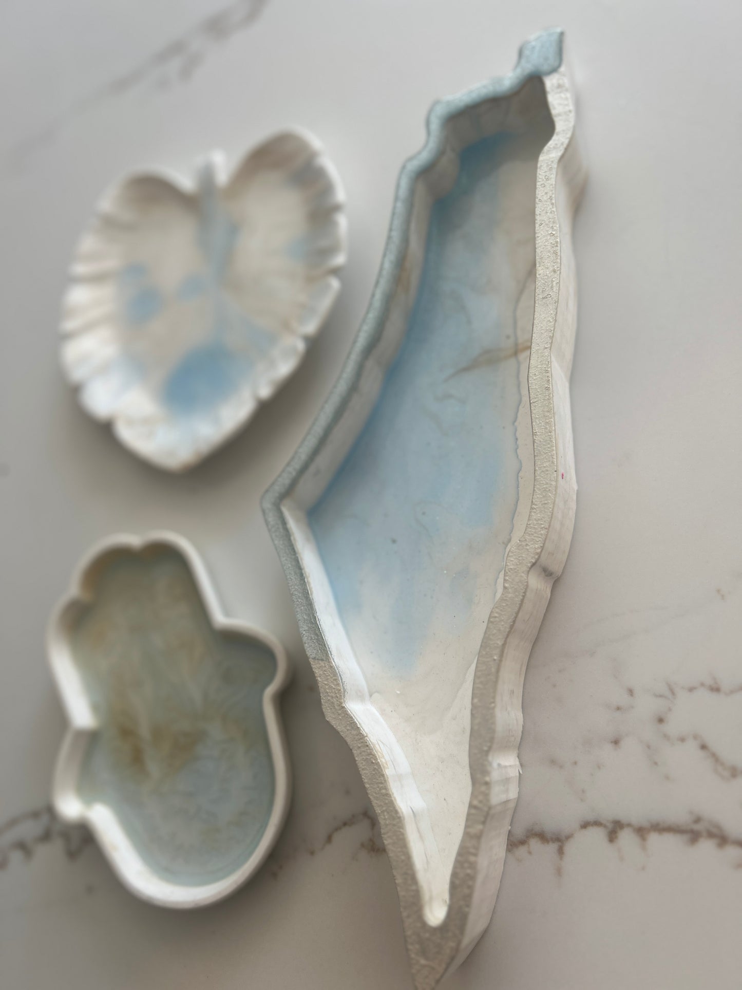 Tray designs inspired by the Map of Israel, Hamsa & Leaf